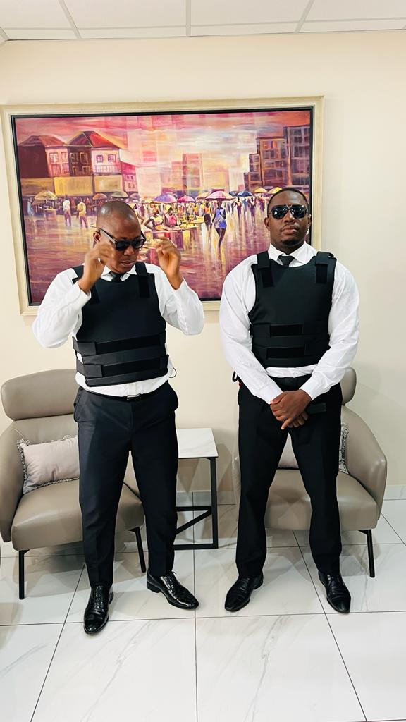handsome bodyguard with security earpiece and gun